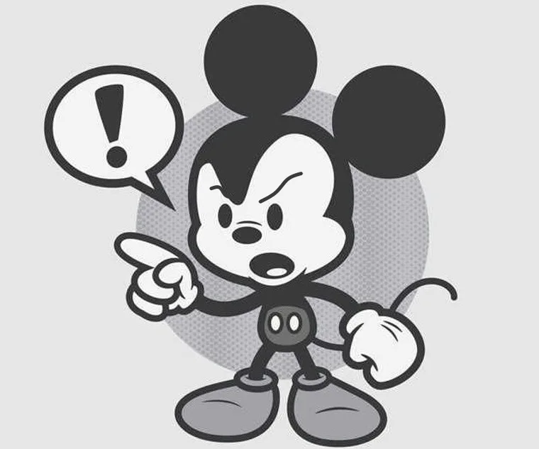 Topolino con espressione arrabbiata che punta il dito, con un fumetto contenente un punto esclamativo.